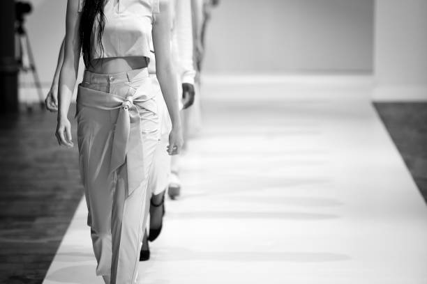 Fashion models at a catwalk during a fashion show Fashion Show, A Catwalk Event, Runway Show fashion show stock pictures, royalty-free photos & images