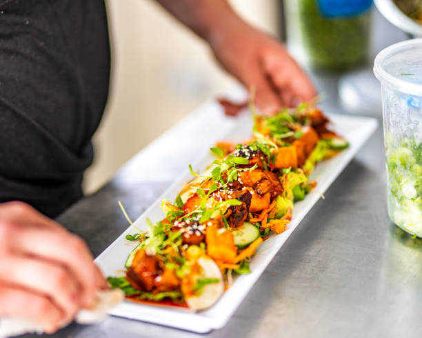 istock Chef wiping plate so that it can be served to eager guest 1436684279