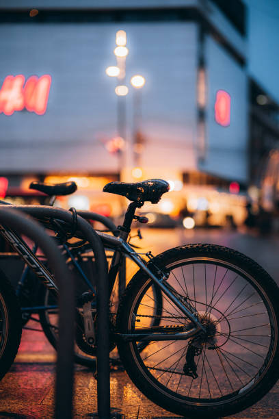 istock Vertical shot of bikes on a bicycle rack at night 1436684456