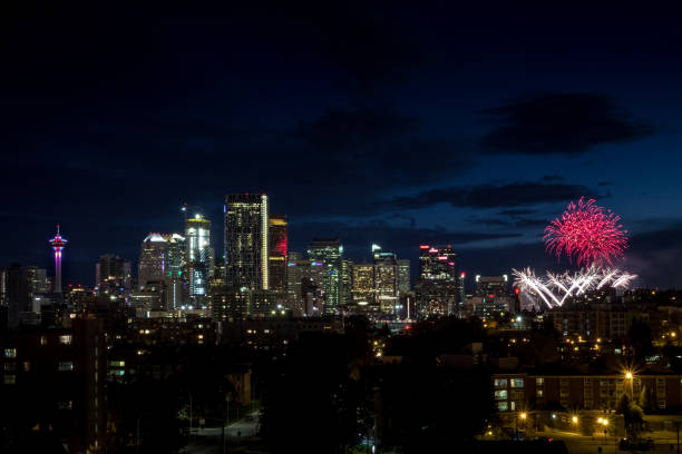 istock Colorful Canada Day fireworks next to skyline buildings at night 1436684503