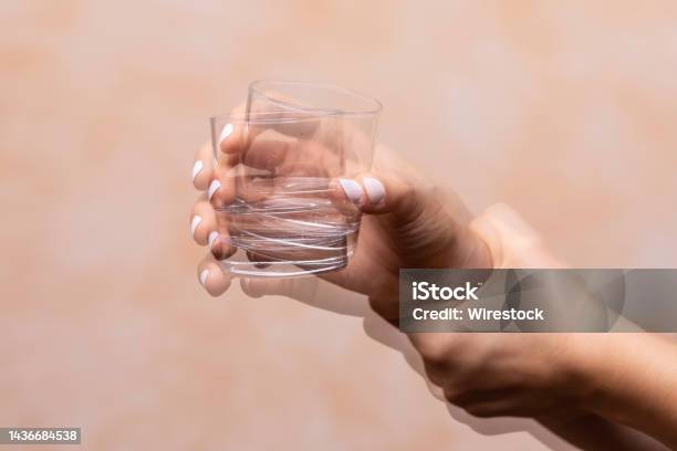 Hand Holding Drinking Glass Suffering From Parkinsons Disease Stock Photo - Download Image Now