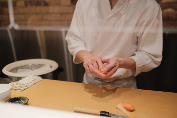 istock Chef making sashimi in a kitchen of a restaurant 1436684694