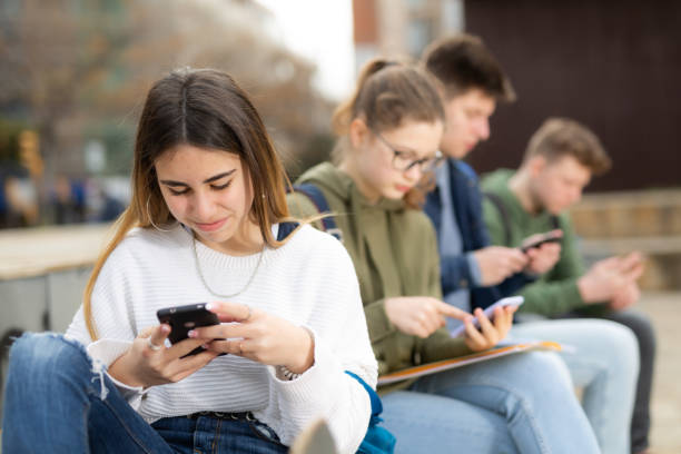 istock Teenagers chatting on their smartphone on walking 1436685711