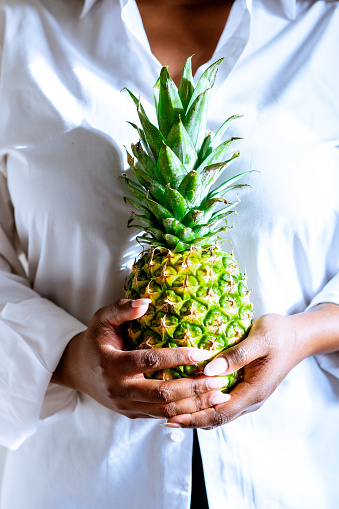Woman Holding Pineapple