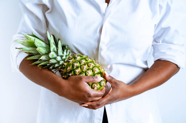 Woman Holding Pineapple