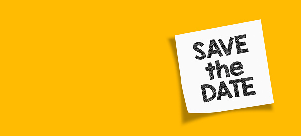 Save the date. save the date message with white note paper on yellow background.