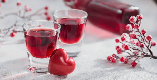istock Red cocktail, vodka or liqueur and Heart shape decorations 1436687246