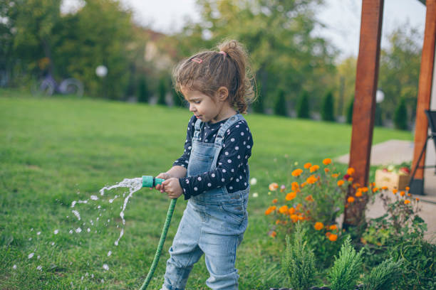 istock Watering my flowers 1436689353