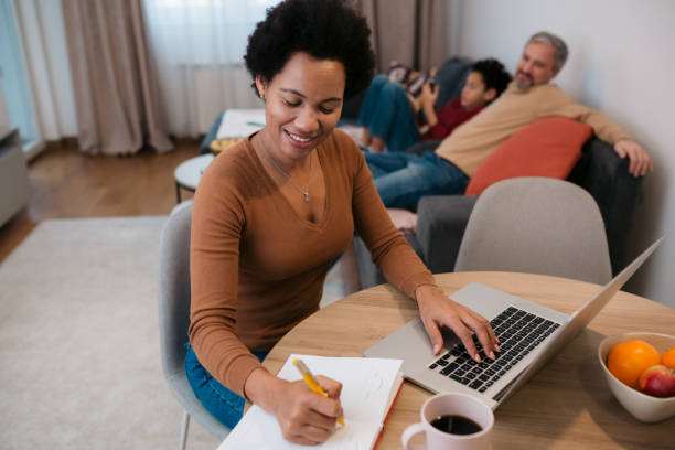 istock Businesswoman working from home using a laptop 1436689953