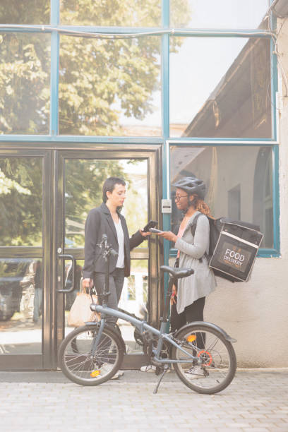istock Customer paying for delivery, smartphone mobile wallet contactless payment 1436691238