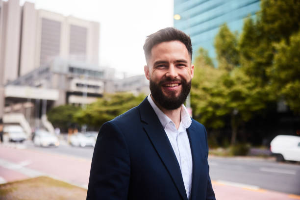 istock Young businessman smiling during his morning commute to work 1436691861