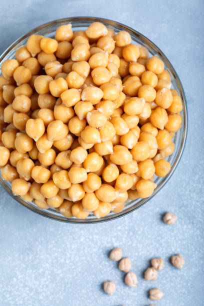 istock Boiled chickpeas in a glass bowl on a gray background. 1436693276