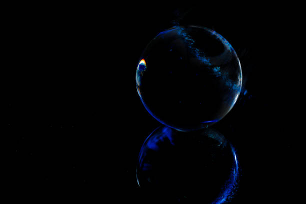 istock Abstraction of a mirrored sphere on a dark background 1436693596