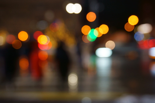 Blurred background. City street in the evening. Background image.