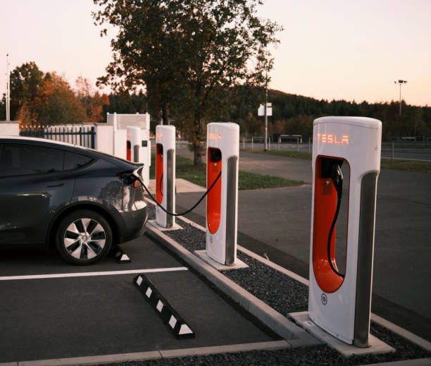 Tesla Model Y charging at the Nurburgring, Germany Nurburg, Germany – October 25, 2021: The Tesla Model Y charging at the Nurburgring, Germany nürburgring stock pictures, royalty-free photos & images