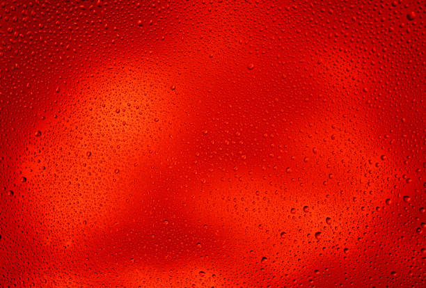 istock Glowing red background with contrasting water drops 1436698976