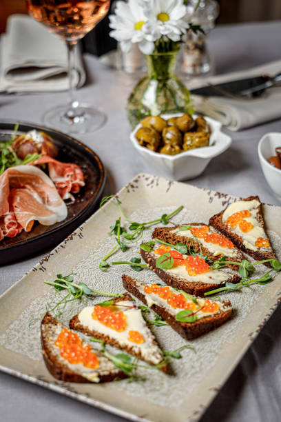 istock Vertical shot of a plate with canapes with red caviar 1436700910