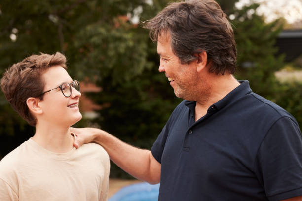 istock A loving father with his hand on his son's shoulder. 1436701096