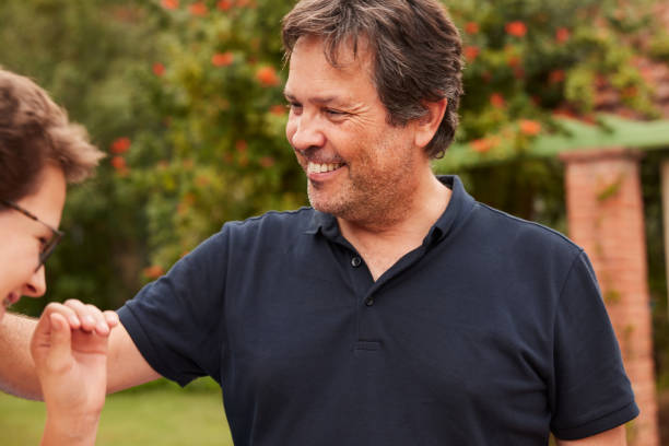 istock A loving father with his hand on his son's shoulder. 1436701105
