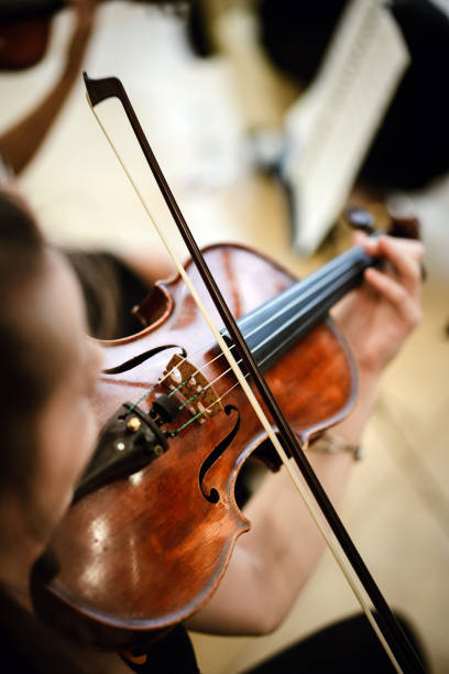istock Unrecognizable woman playing the violin in public 1436701206