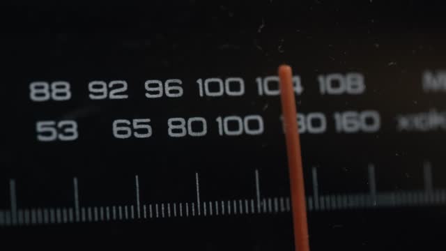 Tuning FM AM radio stations on receiver dial. Change the frequency. Vintage radio, antique, retro. Tuning Red Line. Close-up, Macro shot, Depth of field. Filmed in RAW 120fps 4K