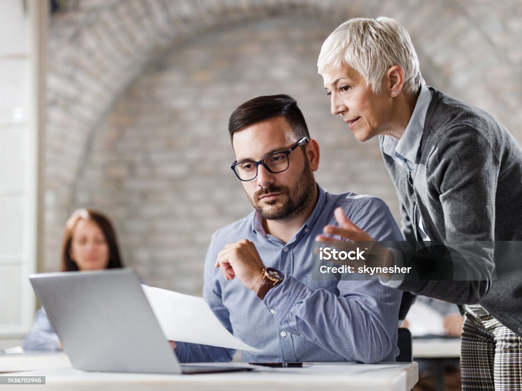 Working Cooperate Entrepreneurs Cooperating While Working On A Computer At Corporate ...