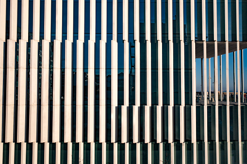 Abstract image of windows on a office building with angular yellow features