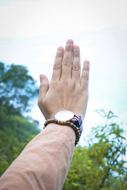 istock Women's hands wearing watches and bracelets 1436707686