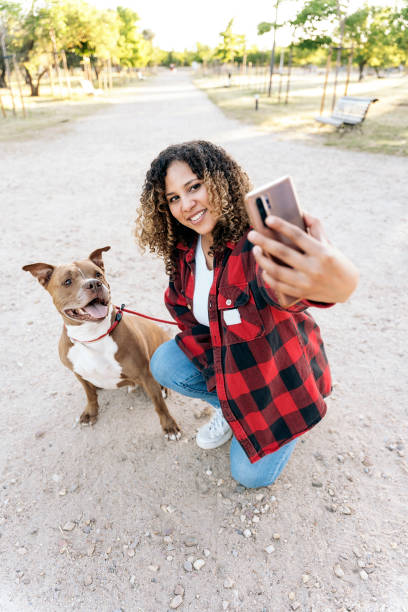 istock Woman Taking Selfie with her Dog 1436707892