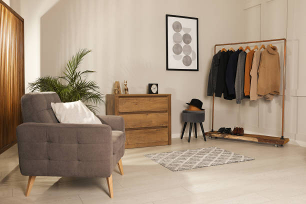 istock Modern dressing room interior with stylish clothes, shoes and decorative elements 1436708457