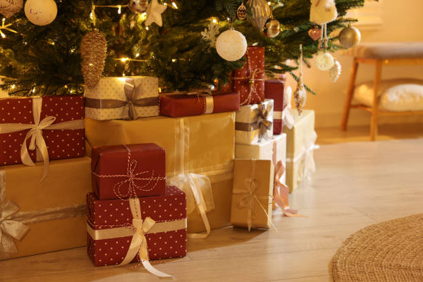 istock Many gift boxes under decorated Christmas tree indoors, closeup 1436709497