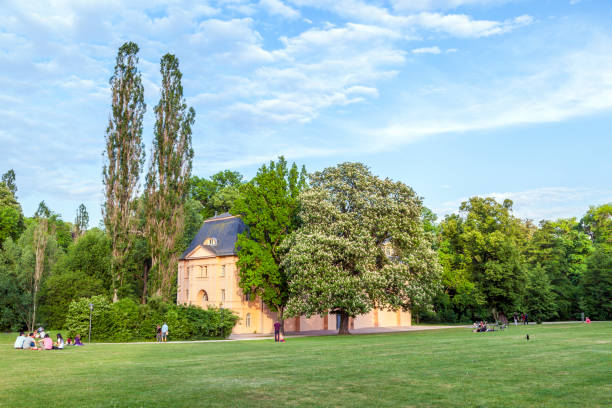 Weimar, Germany - May 27, 2012:  people relax in the ilmpark in weimar, Germany. The park was planned in 1776 under supervision of Johann Wolfgang Goethe. The style is similar to sentimental english  gardenparks.
