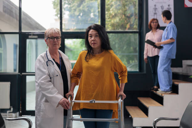 istock Injured patient with leg injury walking with walk frame 1436710453