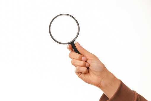 Magnifying glass and monthly calendar