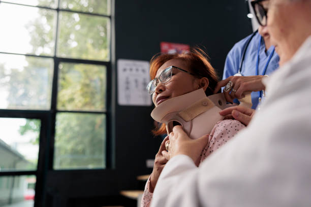 istock Medical assistant and doctor helping senior patient 1436711109