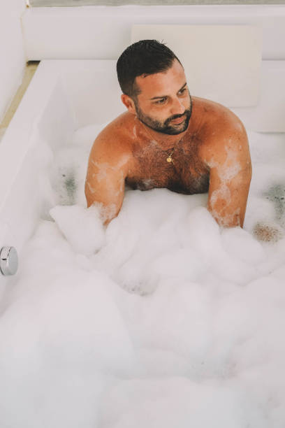 istock man enjoying a bath with foam and bubbles 1436711767