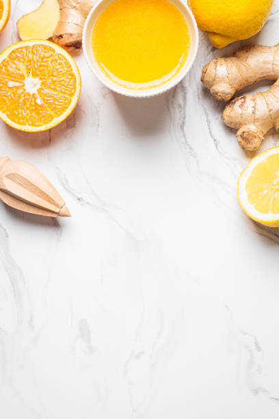 istock Ginger orange drink and ingredients background, copy space. Winter beverage for immunity boosting. 1436711853