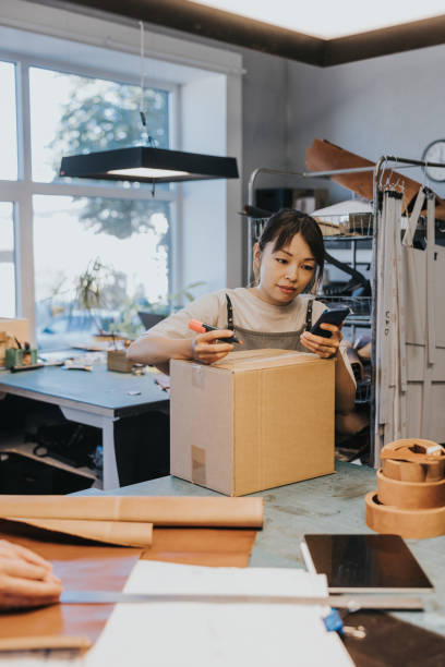 istock Small business owner sending package to customer 1436712357