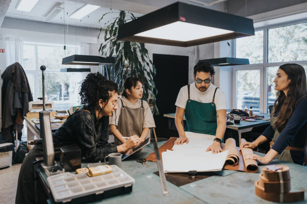 istock Team meeting at small business leather studio 1436712418