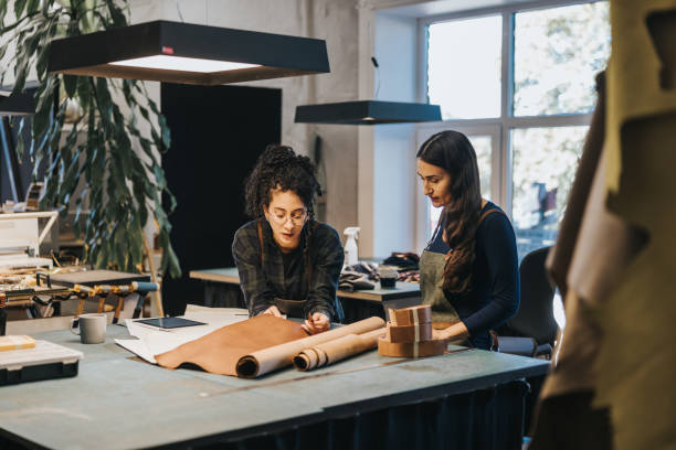 istock Two Latin woman working in their leather studio 1436712489