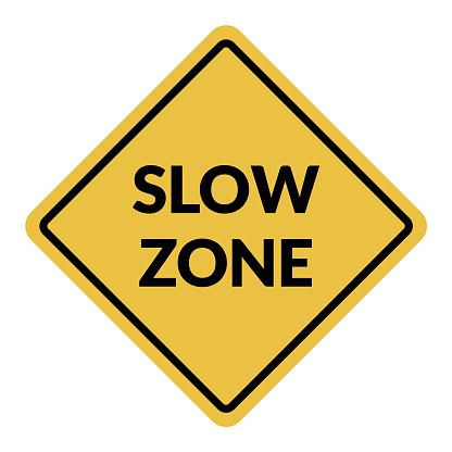 Slow Zone traffic sign. Black on yellow diamond background. Traffic signs and symbols.