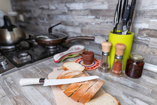 Sliced bread lies on a cutting board on the kitchen table