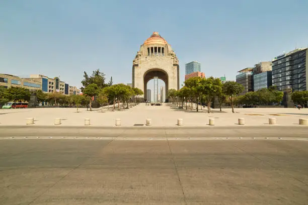 Photo of Famous Monument to the Revolution at the Republic Square of Mexico City under a blue sky