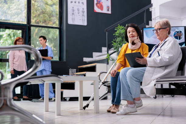 istock Senior specialist consulting patient with cervical neck collar 1436714850