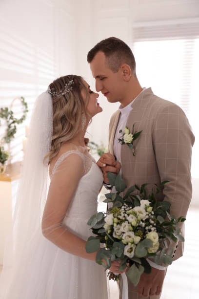 istock Happy bride and groom indoors. Wedding day 1436715305