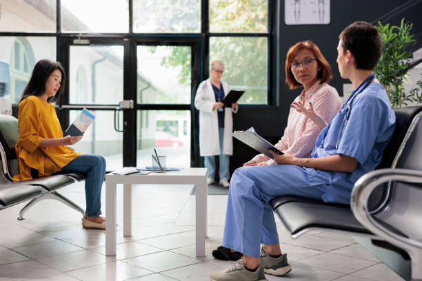 istock Medical nurse taking notes on papers at examination 1436715550