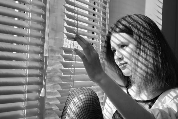 istock sensual girl on window 1436715639
