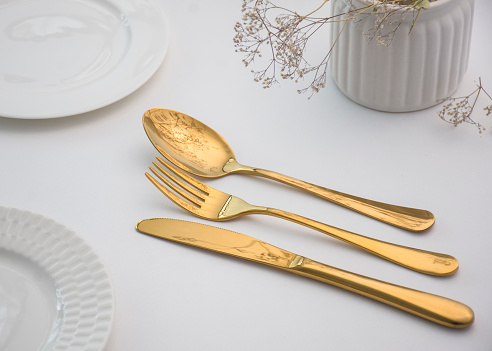 A set of gold cutlery service