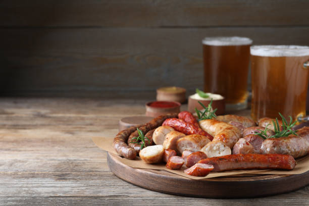istock Set of different tasty snacks and beer on wooden table, space for text 1436716203