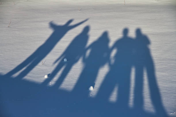 Group of friends making together photo on the snow